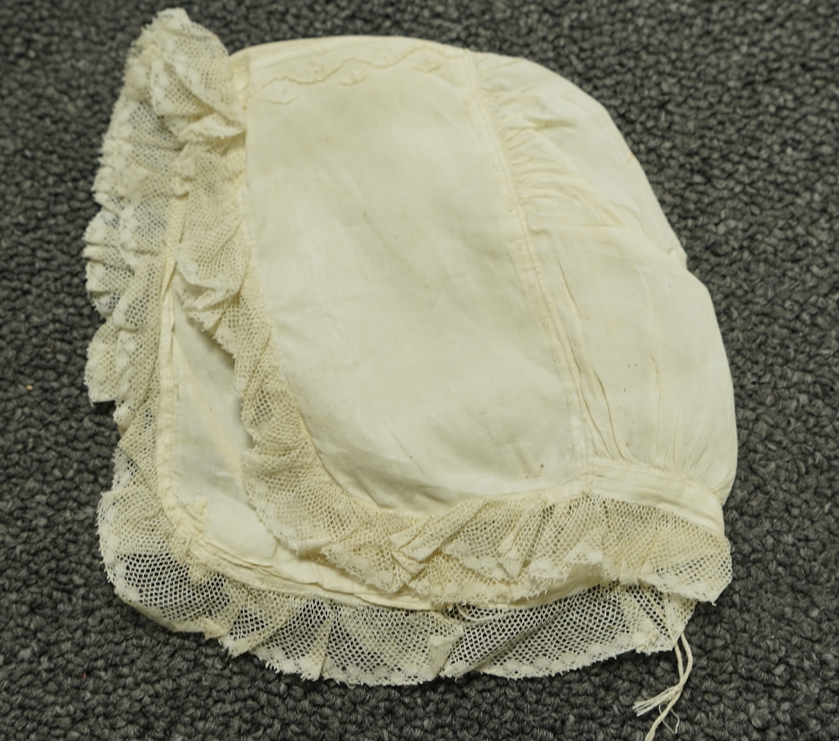 A collection of six baby’s bonnets from the mid 18th century to the late 19th century. An 18th century Hollie Point inserted baby bonnet, a quilted 18th century baby bonnet, two white work bonnets with needle lace crown